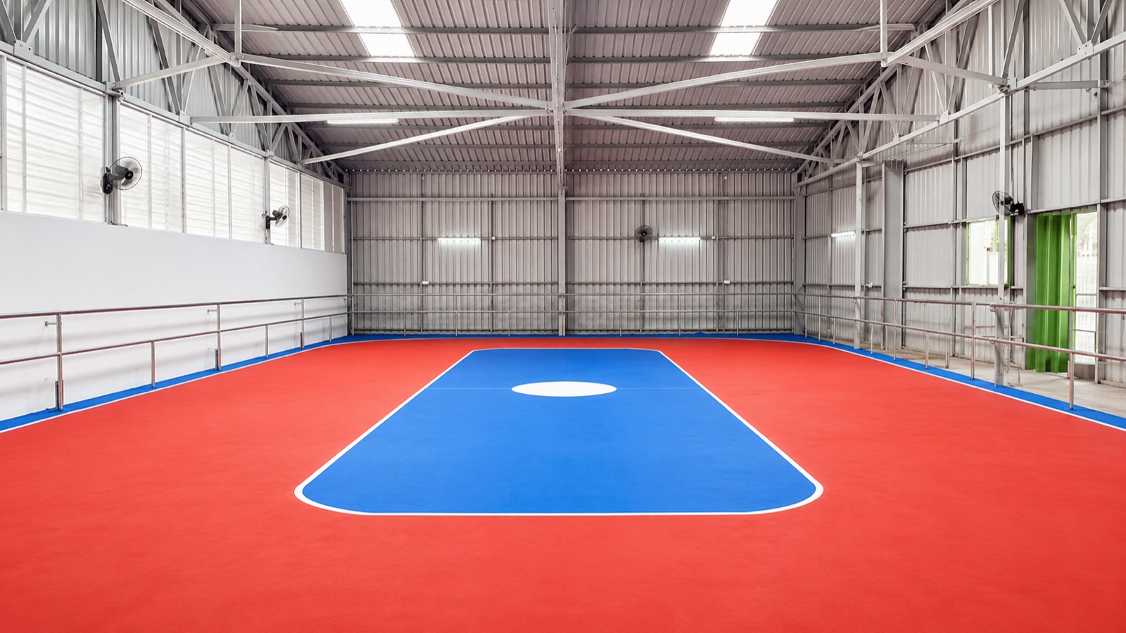 Completed indoor sports hall with synthetic flooring